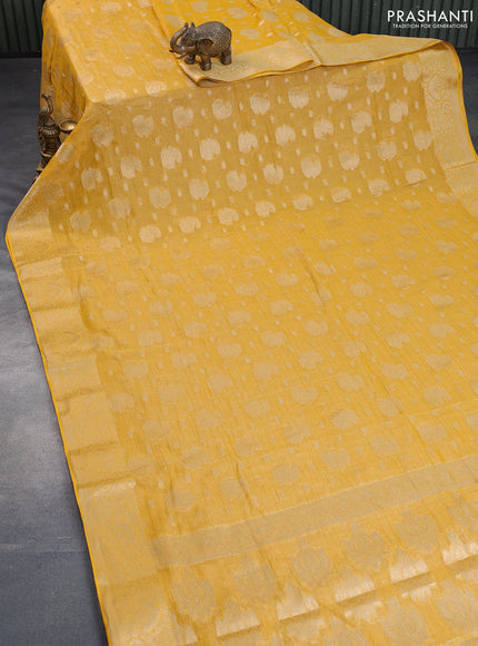 Crushed tissue saree yellow with allover zari woven buttas and zari woven border