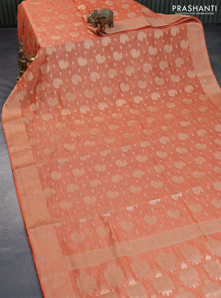 Crushed tissue saree orange with allover zari woven buttas and zari woven border