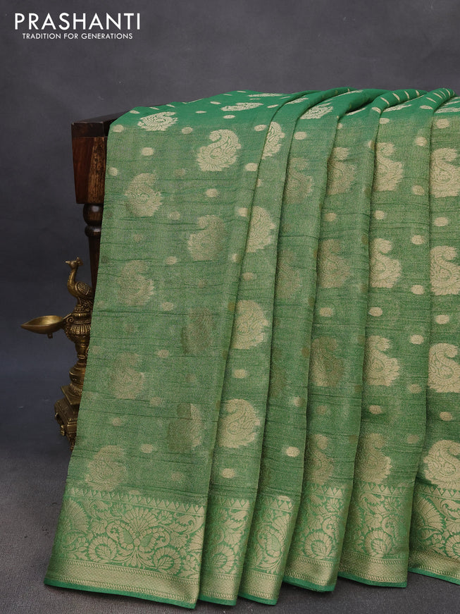 Crushed tissue saree green with allover zari woven buttas and zari woven border