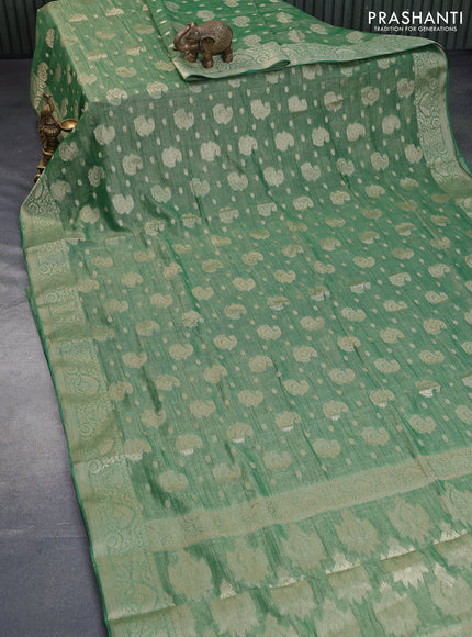 Crushed tissue saree green with allover zari woven buttas and zari woven border