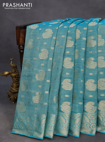 Crushed tissue saree teal blue with allover zari woven buttas and zari woven border