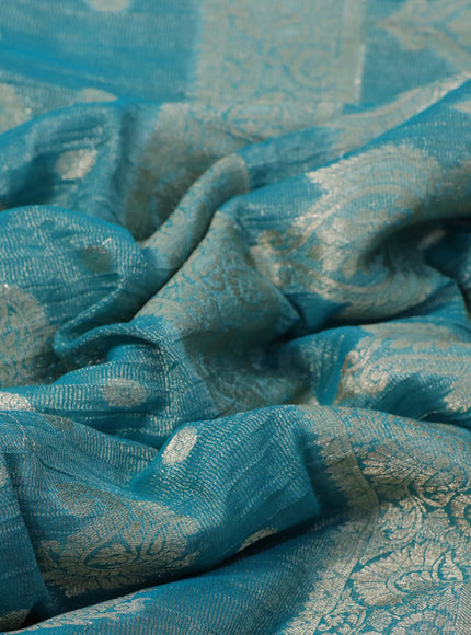 Crushed tissue saree teal blue with allover zari woven buttas and zari woven border