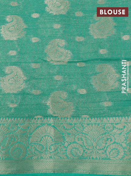 Crushed tissue saree teal green with allover zari woven buttas and zari woven border