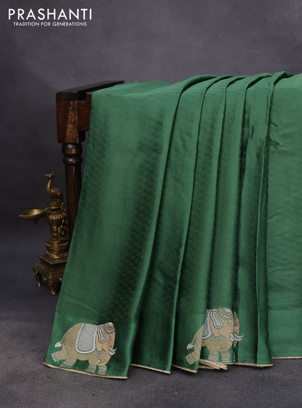 Mushru silk saree green with allover self emboss and elephant zari woven butta border