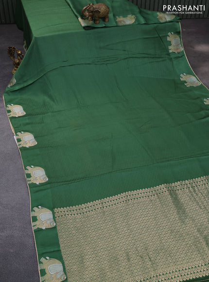 Mushru silk saree green with allover self emboss and elephant zari woven butta border