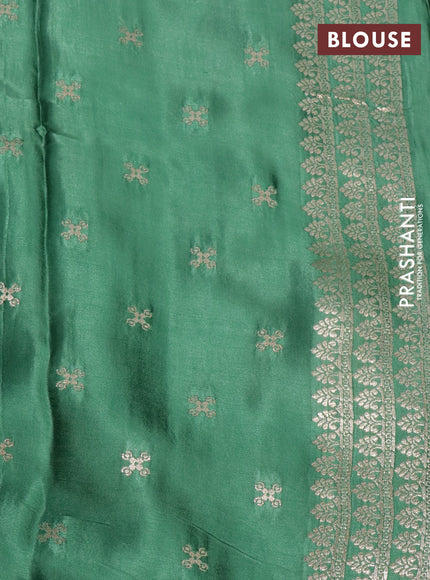 Mushru silk saree green with allover self emboss and elephant zari woven butta border