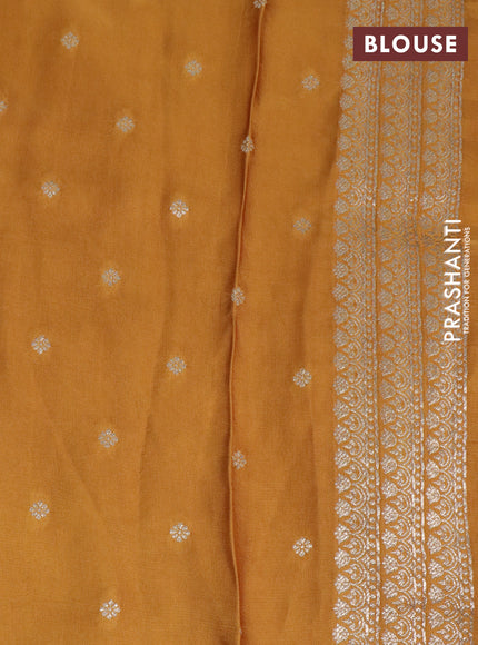 Mushru silk saree with allover self emboss and zari woven butta border