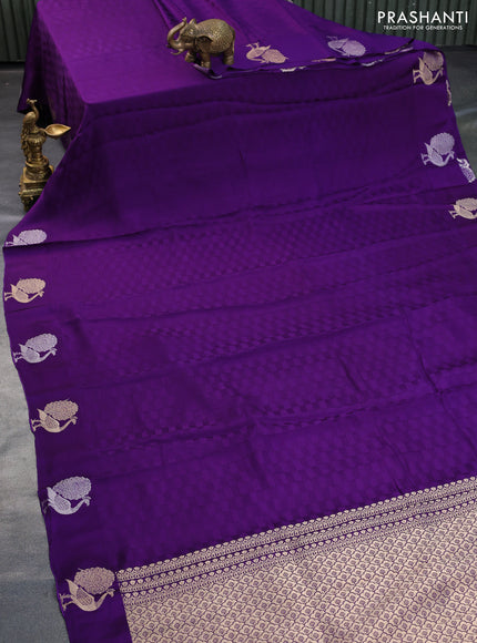 Mushru silk saree violet with allover self emboss and zari woven butta border