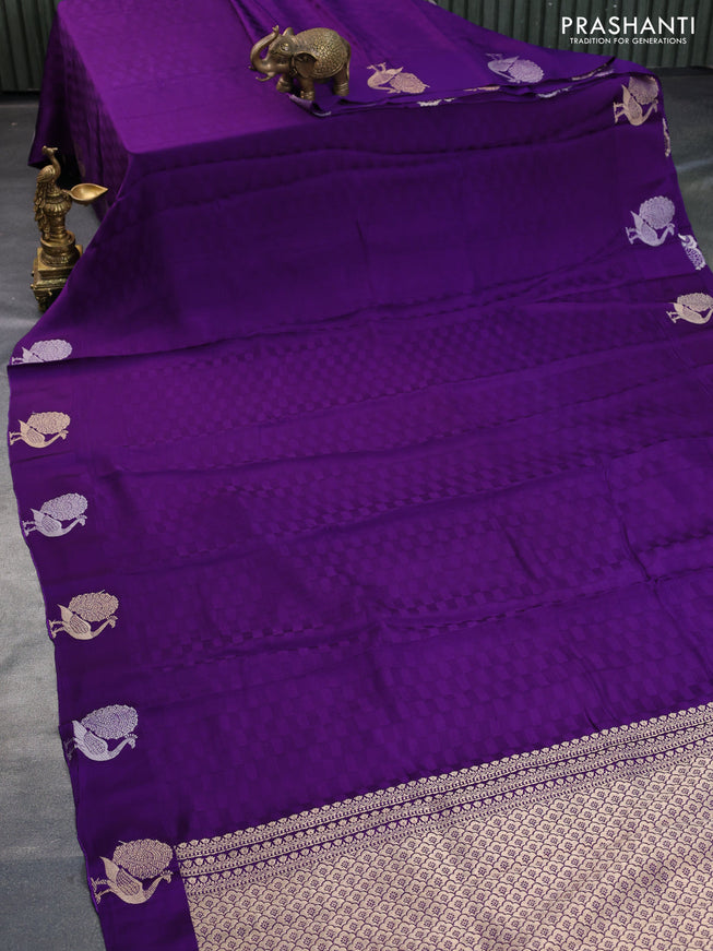 Mushru silk saree violet with allover self emboss and zari woven butta border