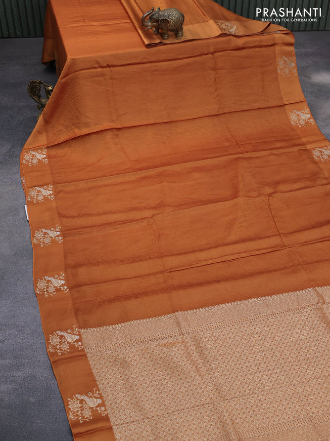 Mushru silk saree mustard shade with allover self emboss and zari woven butta border