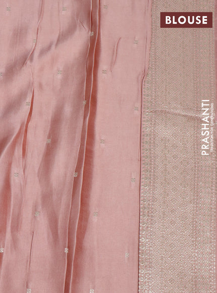 Mushru silk saree pastel peach with allover self emboss and zari woven butta border