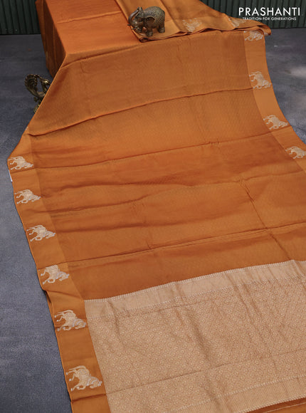 Mushru silk saree mustard shade with allover self emboss and zari woven butta border