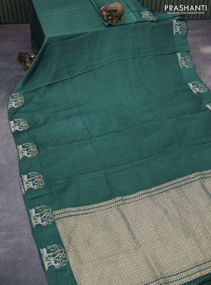 Mushru silk saree green with allover self emboss and zari woven butta border