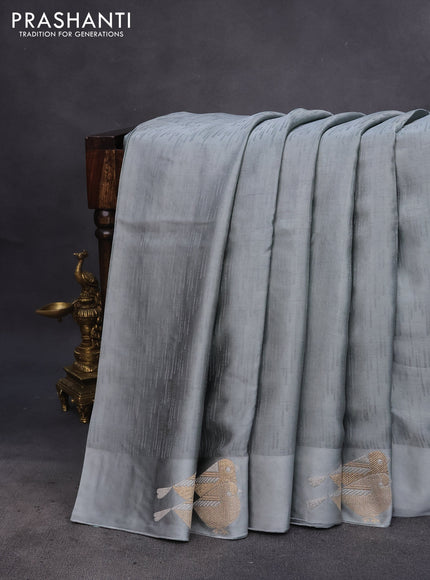 Mushru silk saree grey with allover self emboss and zari woven butta border