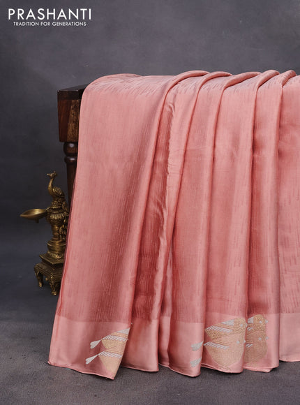 Mushru silk saree pastel peach with allover self emboss and zari woven butta border