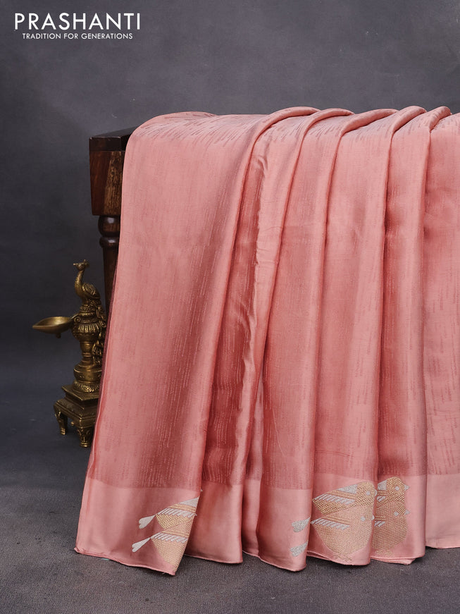 Mushru silk saree pastel peach with allover self emboss and zari woven butta border