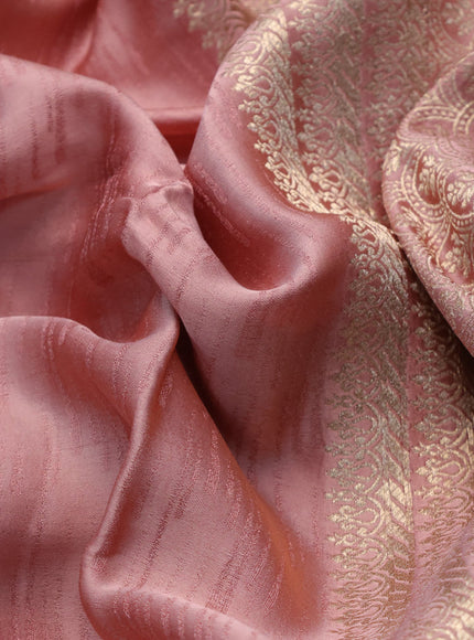 Mushru silk saree pastel peach with allover self emboss and zari woven butta border