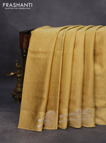 Mushru silk saree yellow with allover self emboss and zari woven butta border