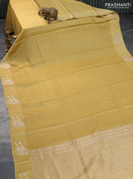 Mushru silk saree yellow with allover self emboss and zari woven butta border