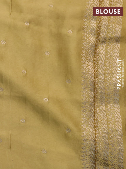 Mushru silk saree yellow with allover self emboss and zari woven butta border