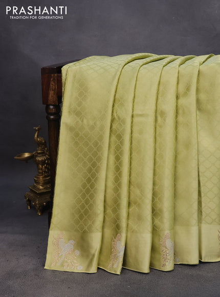 Mushru silk saree pista green with allover self emboss and zari woven butta border