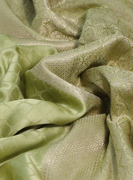 Mushru silk saree pista green with allover self emboss and zari woven butta border