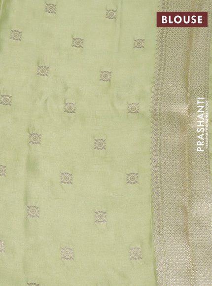 Mushru silk saree pista green with allover self emboss and zari woven butta border