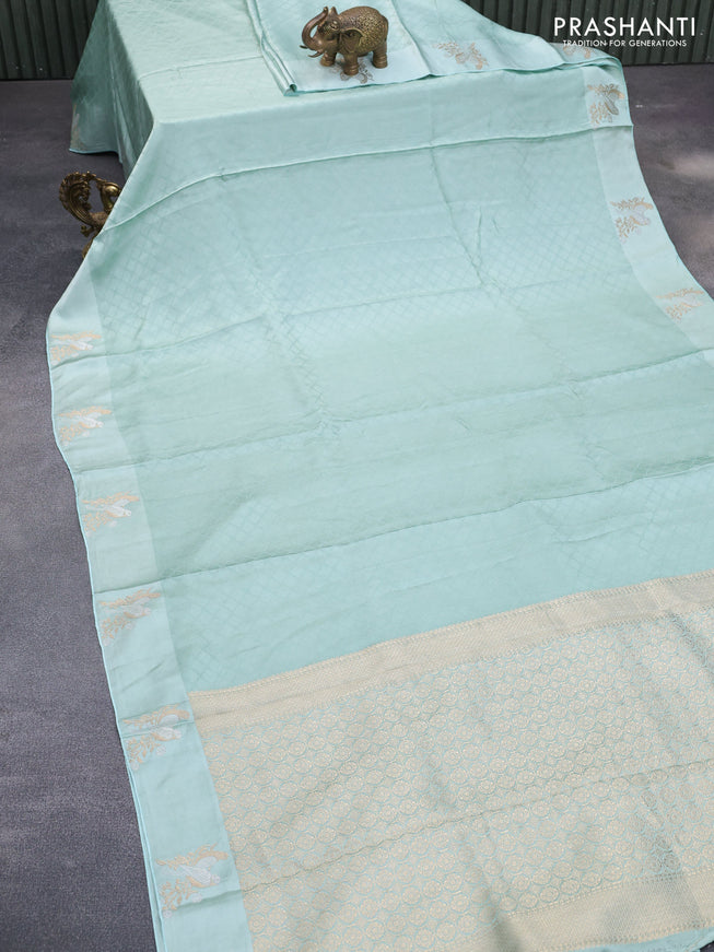 Mushru silk saree pastel blue with allover self emboss and zari woven butta border