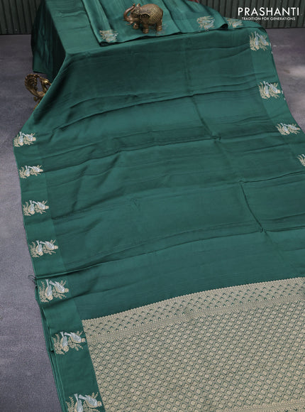 Mushru silk saree green with allover self emboss and zari woven butta border