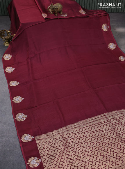 Mushru silk saree maroon with allover self emboss and zari woven butta border