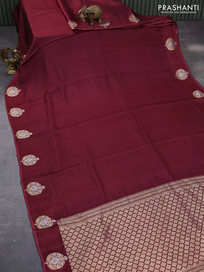 Mushru silk saree maroon with allover self emboss and zari woven butta border