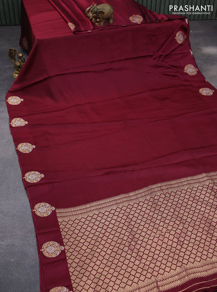 Mushru silk saree maroon with allover self emboss and zari woven butta border