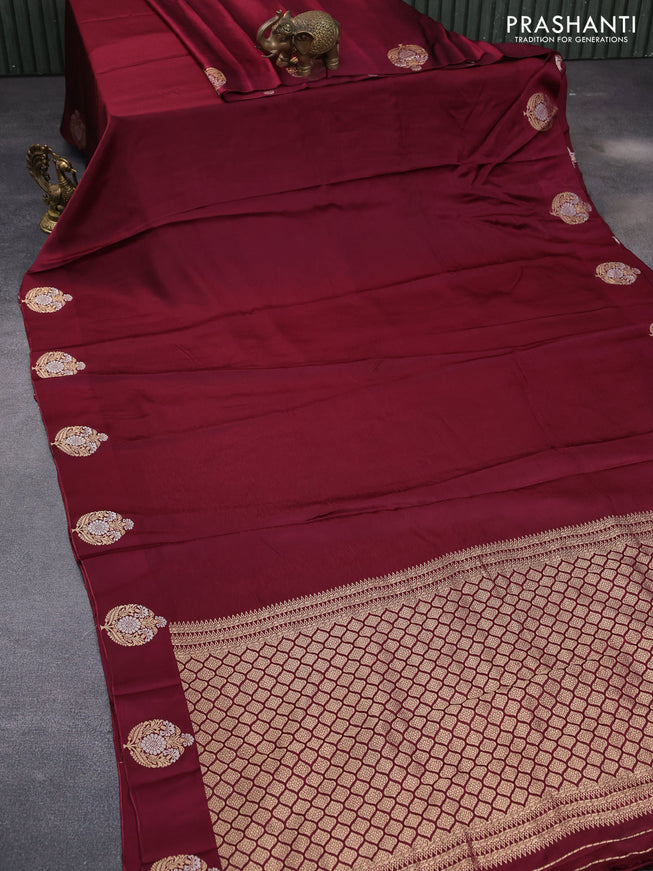 Mushru silk saree maroon with allover self emboss and zari woven butta border