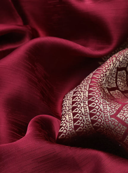 Mushru silk saree maroon with allover self emboss and zari woven butta border