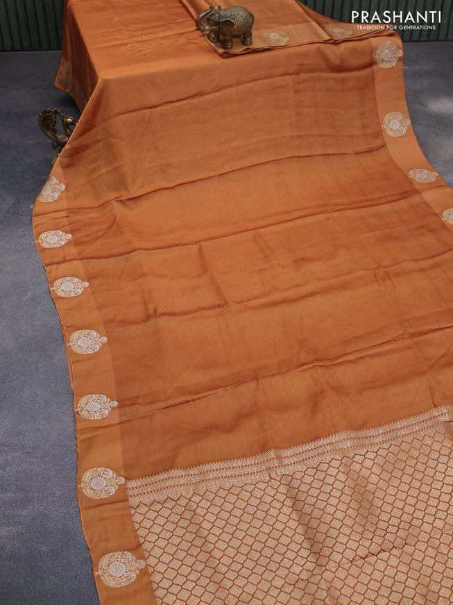 Mushru silk saree mustard shade with allover self emboss and zari woven butta border