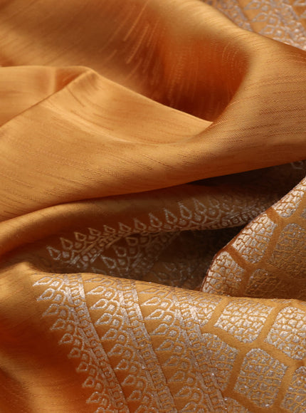 Mushru silk saree mustard yellow with allover self emboss and zari woven butta border