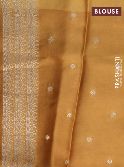 Mushru silk saree mustard yellow with allover self emboss and zari woven butta border