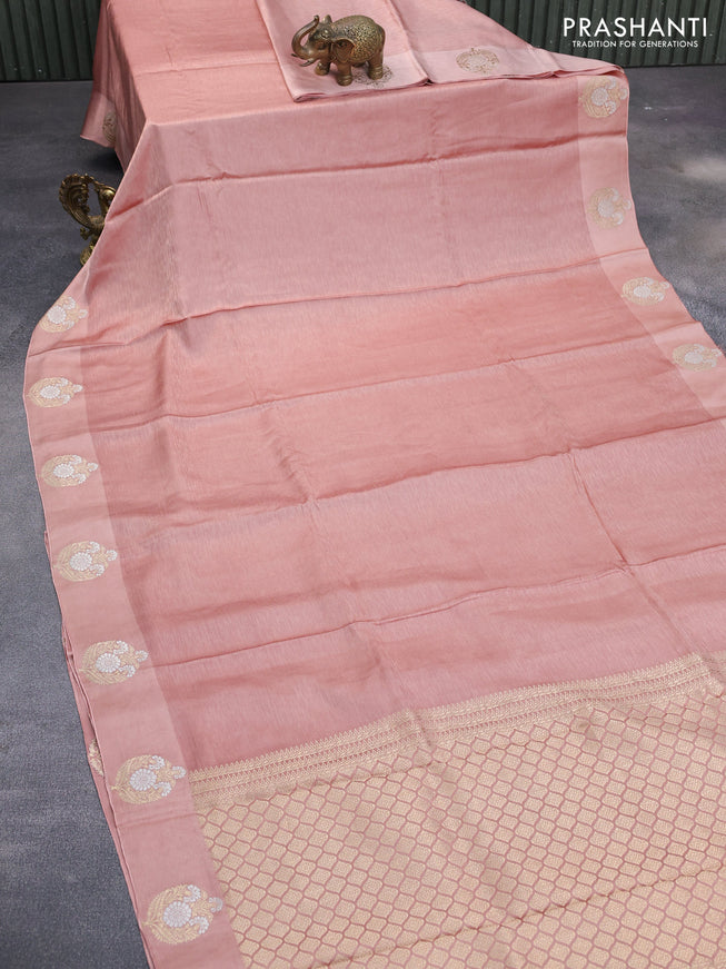 Mushru silk saree peach shade with allover self emboss and zari woven butta border