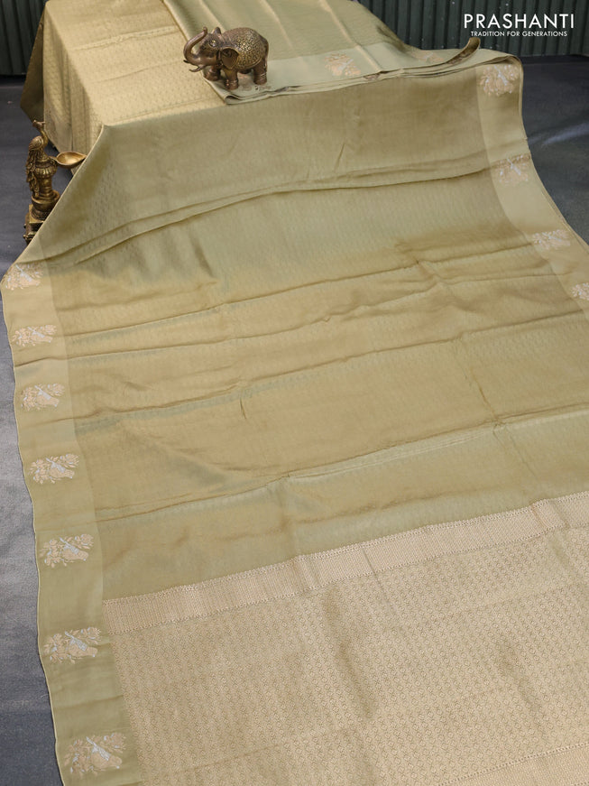 Mushru silk saree elaichi green with allover self emboss and zari woven butta border