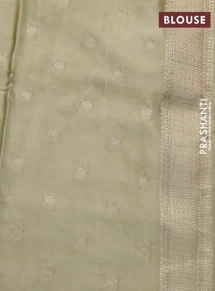 Mushru silk saree elaichi green with allover self emboss and zari woven butta border