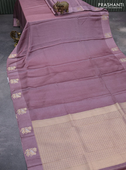 Mushru silk saree pastel purple with allover self emboss and zari woven butta border