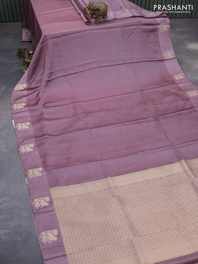 Mushru silk saree pastel purple with allover self emboss and zari woven butta border