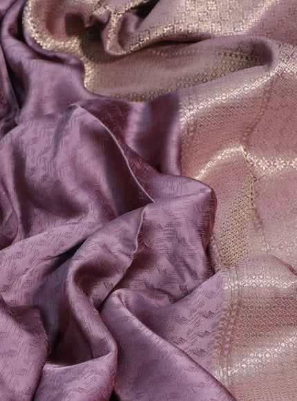 Mushru silk saree pastel purple with allover self emboss and zari woven butta border