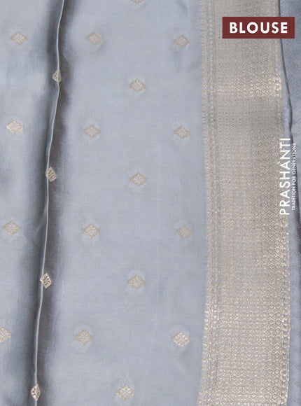 Mushru silk saree grey with allover self emboss and zari woven butta border