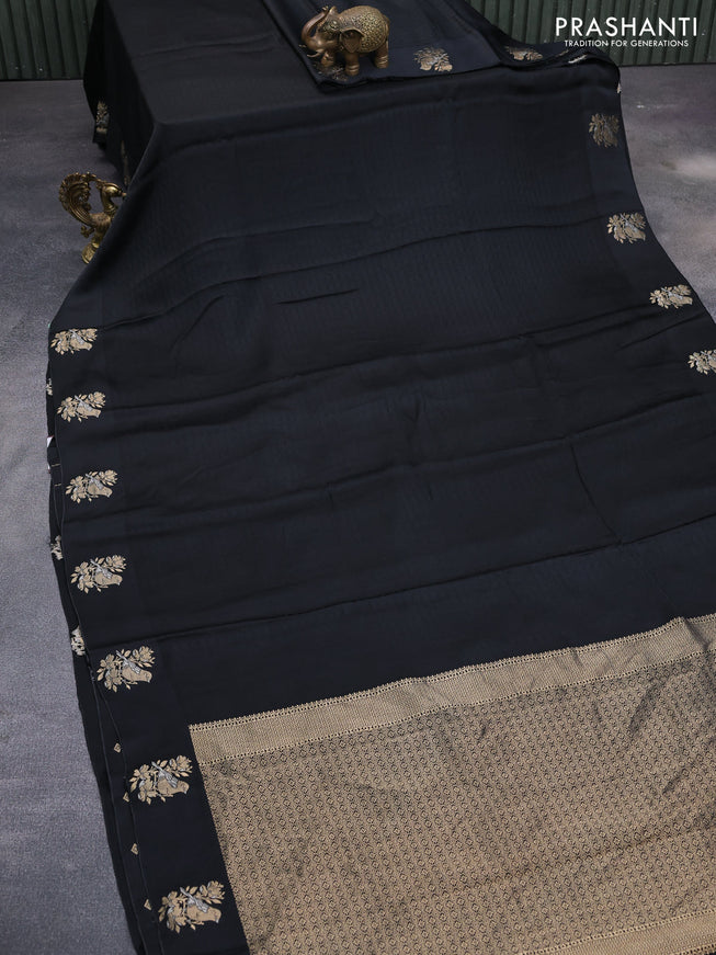 Mushru silk saree black with allover self emboss and zari woven butta border