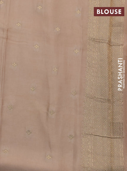 Mushru silk saree sandal with allover self emboss and zari woven butta border