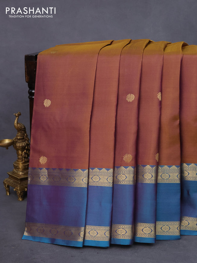 Pure kanchipuram silk saree dual shade of honey and peacock green with zari woven buttas and rettapet zari woven border