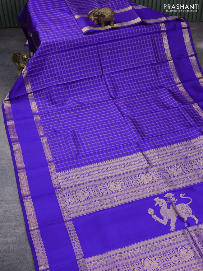 Pure kanchipuram silk saree blue with allover zari checked pattern and rettapet zari woven border