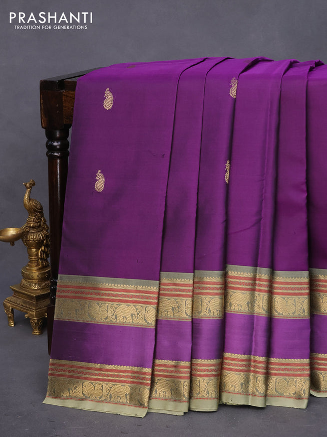 Pure kanchipuram silk saree deep purple and elaichi green with paisley zari woven buttas and rettapet zari woven border