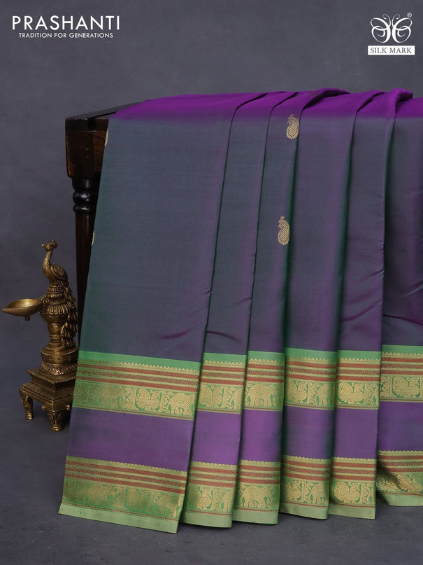 Pure kanchipuram silk saree dual shade of greenish purple and pastel green with paisley zari woven buttas and rettapet zari woven border